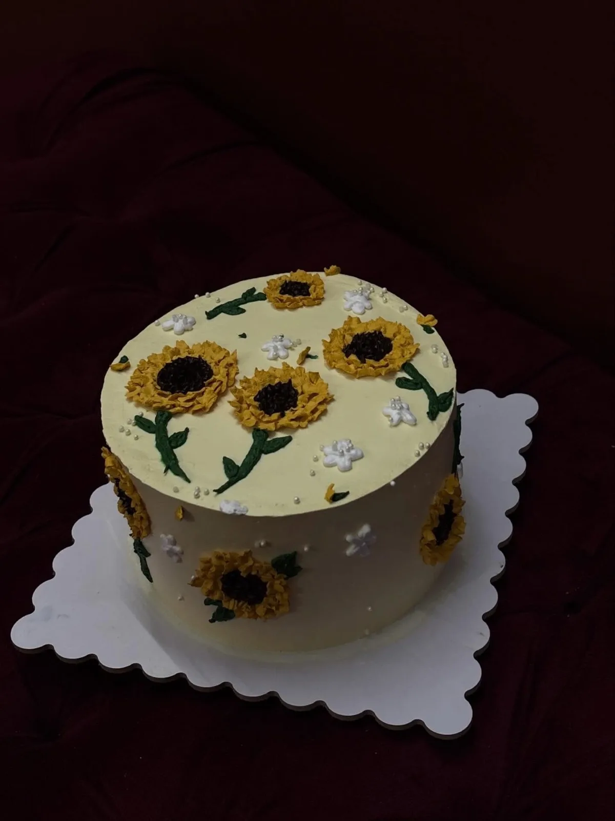 Buttercream cake hand-piped with sunflowers